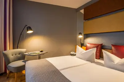 Ein Bett oder Betten in einem Zimmer der Unterkunft Mercure Hotel Berlin Zentrum Superior