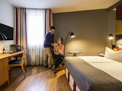 Ein Bett oder Betten in einem Zimmer der Unterkunft Mercure Hotel Berlin Zentrum Superior