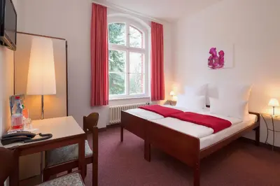 Ein Bett oder Betten in einem Zimmer der Unterkunft Hotel Morgenland