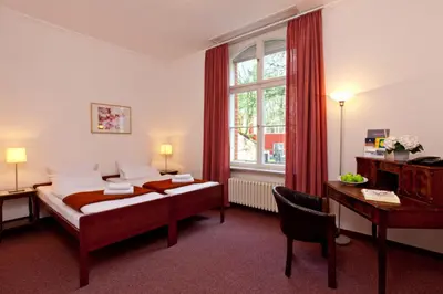 Ein Bett oder Betten in einem Zimmer der Unterkunft Hotel Morgenland