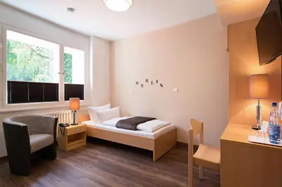 Ein Bett oder Betten in einem Zimmer der Unterkunft Hotel Morgenland