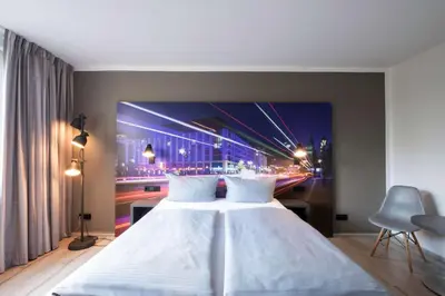 Ein Bett oder Betten in einem Zimmer der Unterkunft Hotel Berlin Lichtenberg