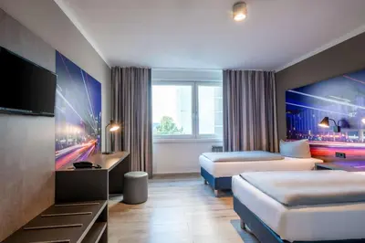 Ein Bett oder Betten in einem Zimmer der Unterkunft Hotel Berlin Lichtenberg