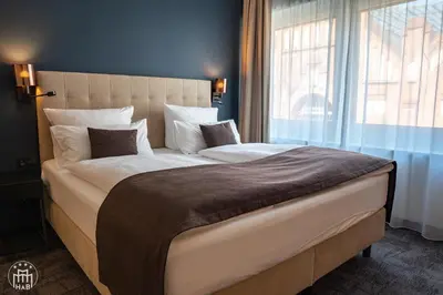 Ein Bett oder Betten in einem Zimmer der Unterkunft Hotel am Borsigturm