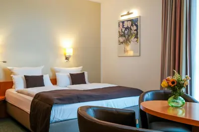 Ein Bett oder Betten in einem Zimmer der Unterkunft Hotel am Borsigturm