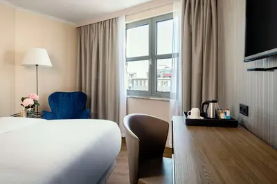 Ein Bett oder Betten in einem Zimmer der Unterkunft NH Berlin Kurfürstendamm