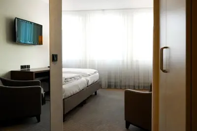 Ein Bett oder Betten in einem Zimmer der Unterkunft Sylter Hof Berlin