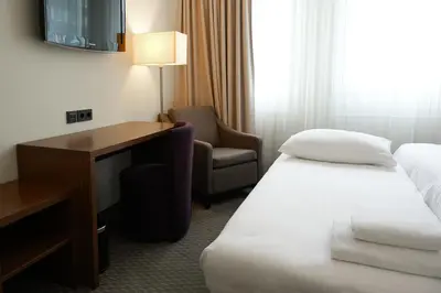 Ein Bett oder Betten in einem Zimmer der Unterkunft Sylter Hof Berlin
