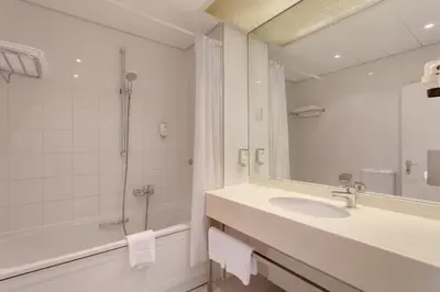 Ein Badezimmer in der Unterkunft Sylter Hof Berlin