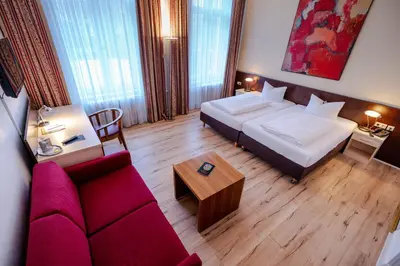 Ein Bett oder Betten in einem Zimmer der Unterkunft Hotel Tiergarten Berlin