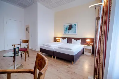 Ein Bett oder Betten in einem Zimmer der Unterkunft Hotel Tiergarten Berlin