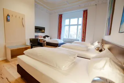 Ein Bett oder Betten in einem Zimmer der Unterkunft Hotel Tiergarten Berlin