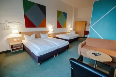Ein Bett oder Betten in einem Zimmer der Unterkunft Hotel Tiergarten Berlin