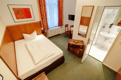 Ein Bett oder Betten in einem Zimmer der Unterkunft Hotel Tiergarten Berlin