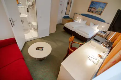 Ein Bett oder Betten in einem Zimmer der Unterkunft Hotel Tiergarten Berlin
