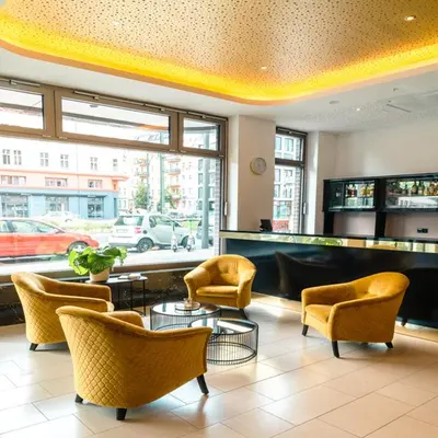 Ein Sitzbereich in der Unterkunft Gold Palais Hotel