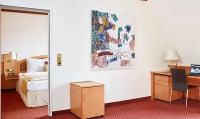 Ein Bett oder Betten in einem Zimmer der Unterkunft Living Hotel Großer Kurfürst