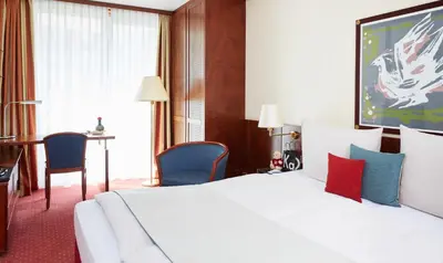 Ein Bett oder Betten in einem Zimmer der Unterkunft Living Hotel Weißensee