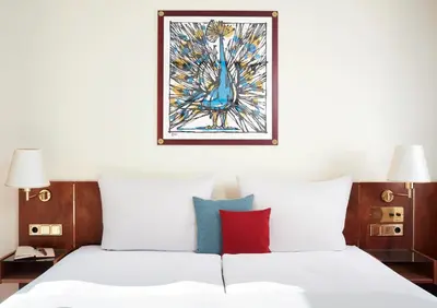 Ein Bett oder Betten in einem Zimmer der Unterkunft Living Hotel Weißensee