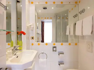 Ein Badezimmer in der Unterkunft Living Hotel Berlin Mitte