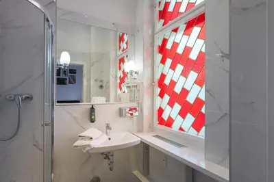 Ein Badezimmer in der Unterkunft Hotel Augusta Am Kurfürstendamm