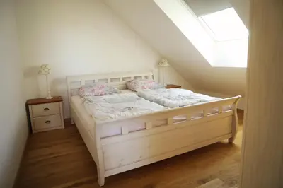 Ein Bett oder Betten in einem Zimmer der Unterkunft Ferienwohnung am Mühlenteich