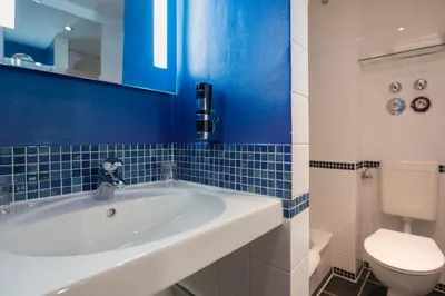 Ein Badezimmer in der Unterkunft SORAT Hotel Berlin