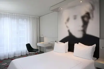 Ein Bett oder Betten in einem Zimmer der Unterkunft Park Plaza Berlin