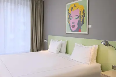 Ein Bett oder Betten in einem Zimmer der Unterkunft Park Plaza Berlin