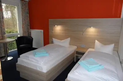 Ein Bett oder Betten in einem Zimmer der Unterkunft Hotel Sperlingshof