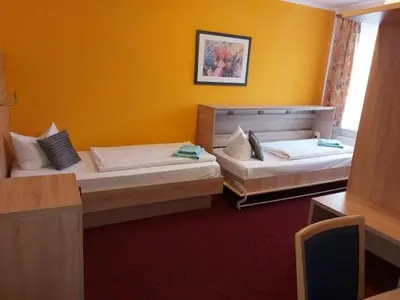 Ein Bett oder Betten in einem Zimmer der Unterkunft Hotel Sperlingshof