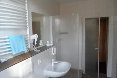 Ein Badezimmer in der Unterkunft Hotel Sperlingshof