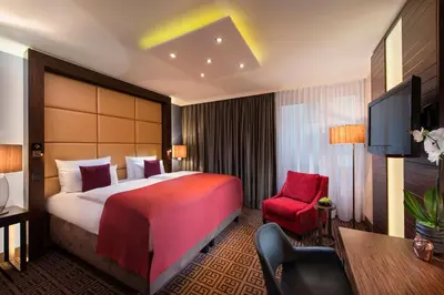 Ein Bett oder Betten in einem Zimmer der Unterkunft Hotel Palace Berlin
