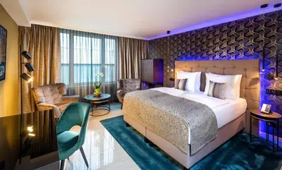 Ein Bett oder Betten in einem Zimmer der Unterkunft Hotel Palace Berlin