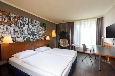 Ein Bett oder Betten in einem Zimmer der Unterkunft Seminaris SeeHotel Potsdam