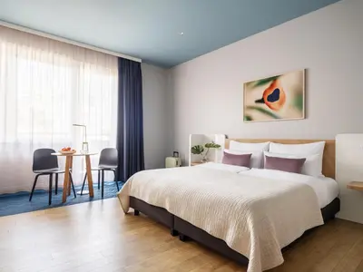 Ein Bett oder Betten in einem Zimmer der Unterkunft Numa Berlin Kudamm