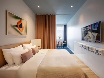 Ein Bett oder Betten in einem Zimmer der Unterkunft Numa Berlin Kudamm