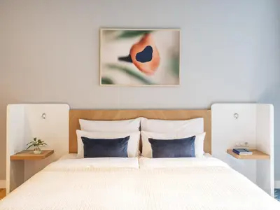Ein Bett oder Betten in einem Zimmer der Unterkunft Numa Berlin Kudamm