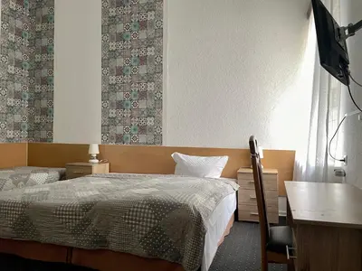 Ein Bett oder Betten in einem Zimmer der Unterkunft Hotel Castell am Kurfürstendamm
