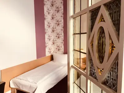 Ein Bett oder Betten in einem Zimmer der Unterkunft Hotel Castell am Kurfürstendamm