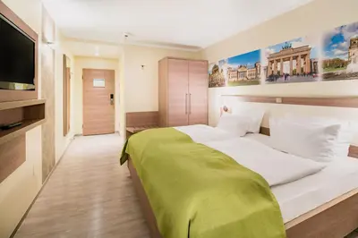 Ein Bett oder Betten in einem Zimmer der Unterkunft Best Western Hotel Kantstrasse Berlin