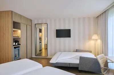 Ein Bett oder Betten in einem Zimmer der Unterkunft NH Berlin Alexanderplatz