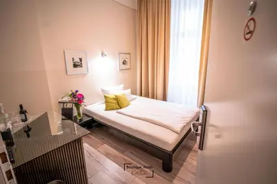 Ein Bett oder Betten in einem Zimmer der Unterkunft Boutique Hotel Kerlin