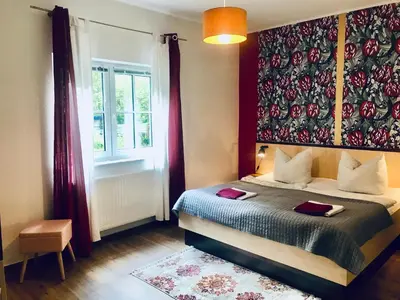 Ein Bett oder Betten in einem Zimmer der Unterkunft Waldschenke Stendenitz Übernachten im Wald am See
