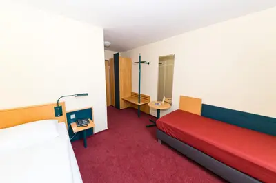 Ein Bett oder Betten in einem Zimmer der Unterkunft Akzent Parkhotel Trebbin