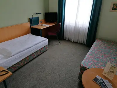Ein Bett oder Betten in einem Zimmer der Unterkunft Akzent Parkhotel Trebbin