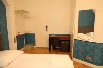 Ein Bett oder Betten in einem Zimmer der Unterkunft Art Hotel Charlottenburger Hof Berlin