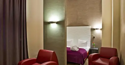 Ein Sitzbereich in der Unterkunft Artim Hotel