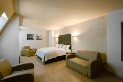 Ein Bett oder Betten in einem Zimmer der Unterkunft Artim Hotel