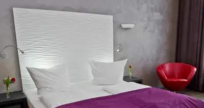 Ein Bett oder Betten in einem Zimmer der Unterkunft Artim Hotel